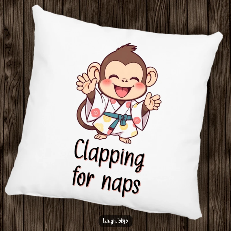Funny monkey in a bright kimono, clapping joyfully, on a soft decorative pillow, offering cheerful comfort and a humorous touch.