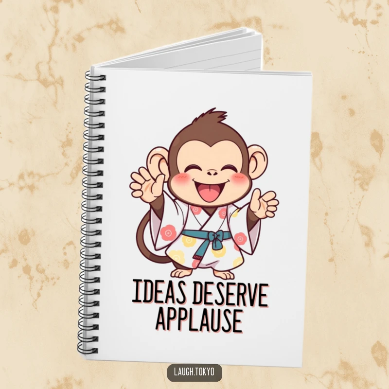Funny monkey in a bright kimono, clapping joyfully, on a notebook cover, ideal for cheerful journaling and as a funny gift.